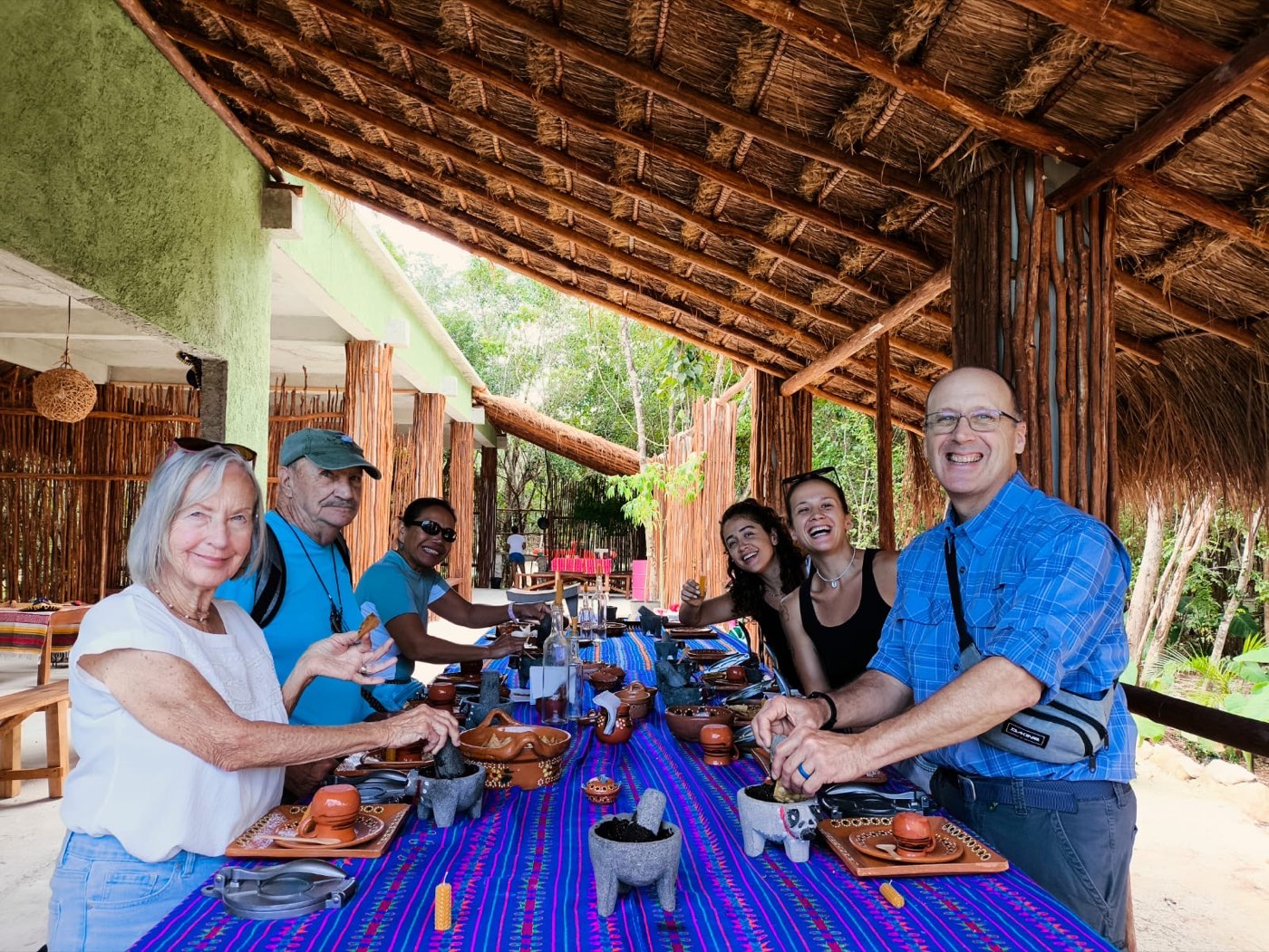 Guests laughing over the lunch they cooked themselves