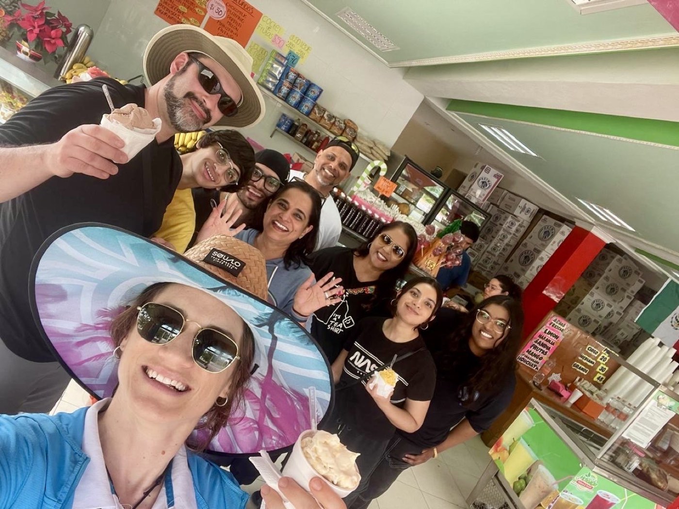 Guests crowding into a selfie over fresh fruit ice cream