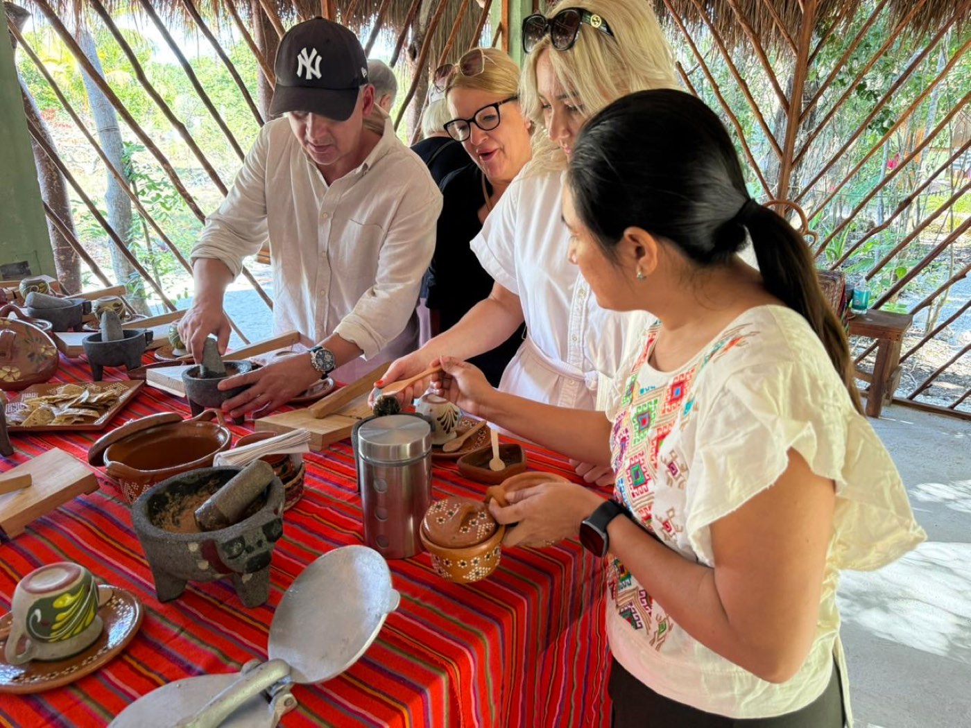 Guests grinding by hand with our host
