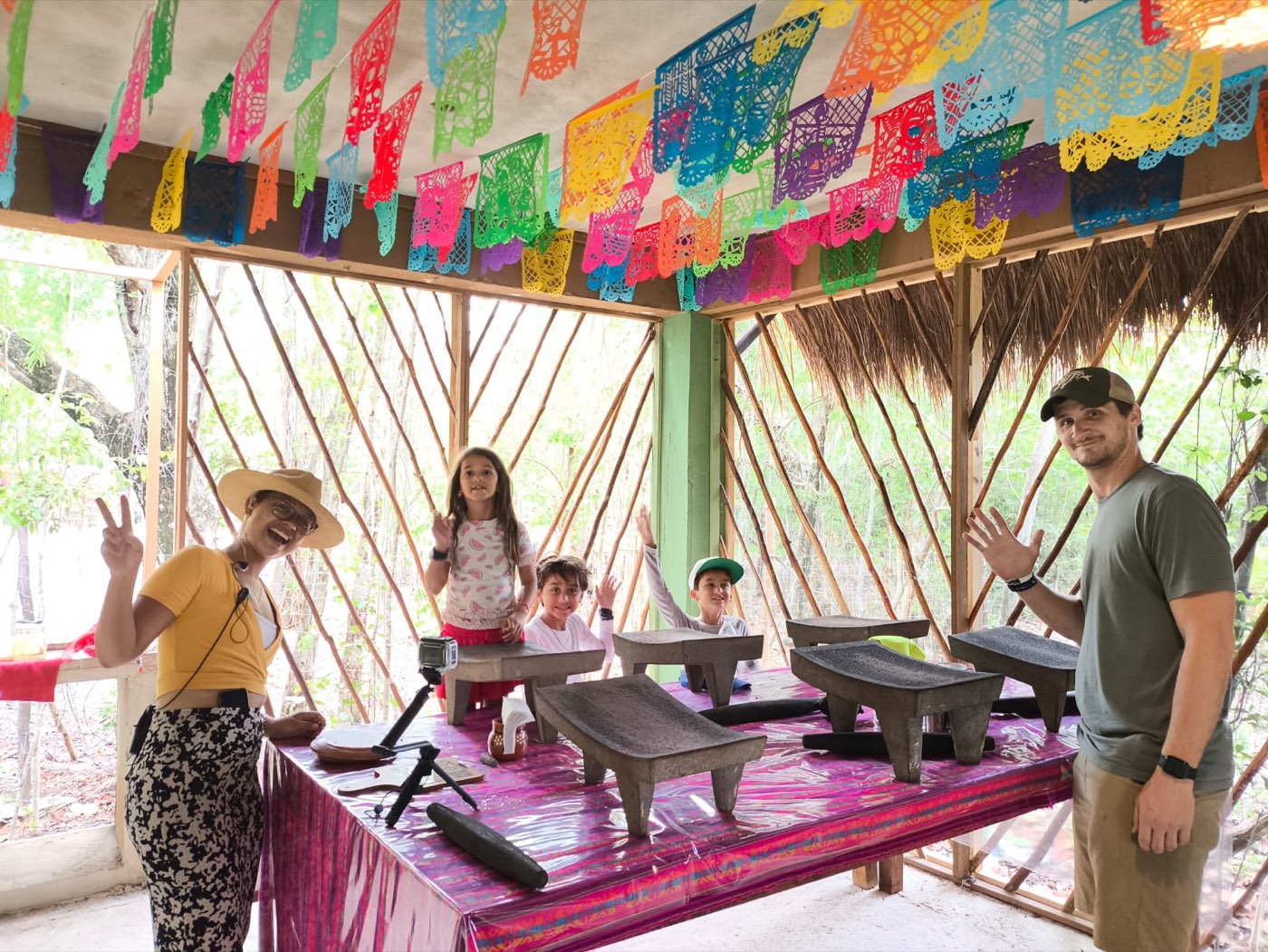Kids in the palapa, hands in the air