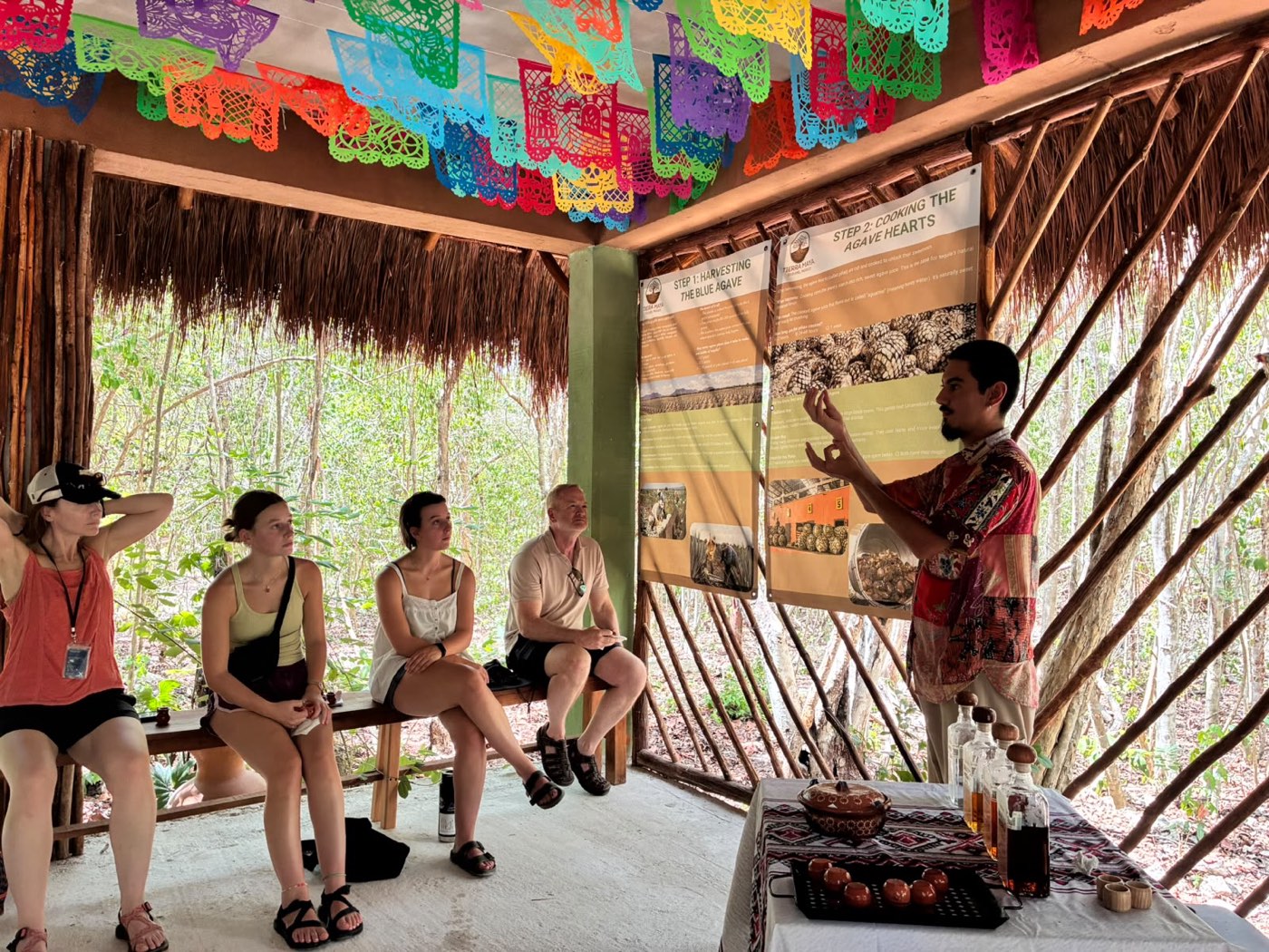 A host in a straw hat explaining the tasting